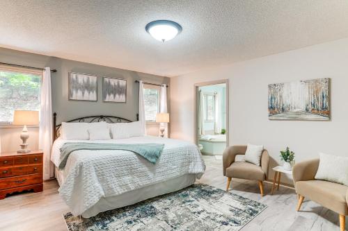 a bedroom with a bed and a chair at Spacious Massanutten Home with Hot Tub and Sauna! in McGaheysville