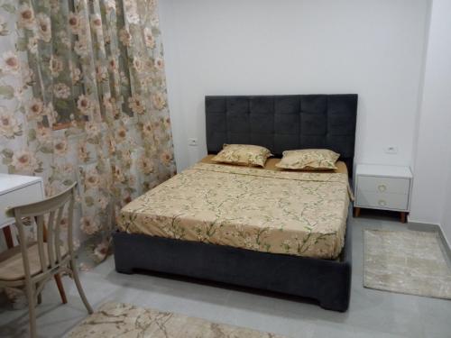 Łóżko lub łóżka w pokoju w obiekcie Appartement Ben Arous