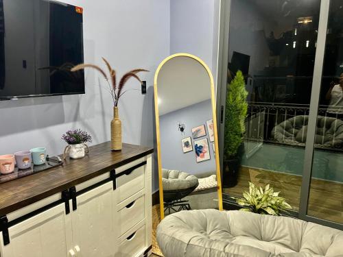 a dressing room with a mirror and a dressing table at Green House - Căn hộ có bếp riêng in Da Lat