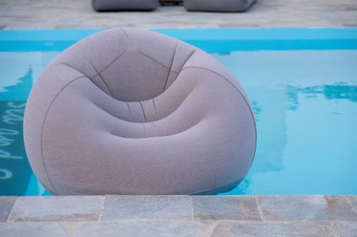 a large white ball sitting in a swimming pool at Sea and sun in Kalamitsa