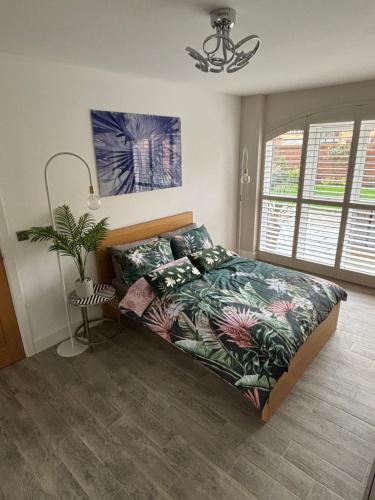 a bedroom with a bed with a plant on it at Kingsbarns in Scunthorpe