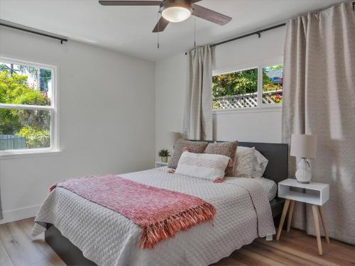 a bedroom with a bed and a ceiling fan at Hollywood Dream pool home & king beds in Los Angeles