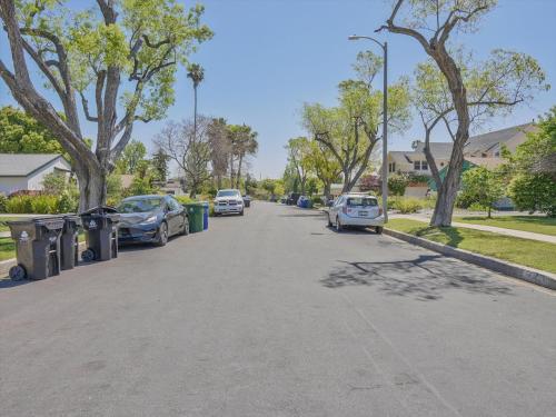 a street with cars parked on the side of the road at Hollywood Dream pool home & king beds in Los Angeles