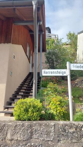 a staircase to a building with a sign that reads heritance at auszeit34 in Ebelsbach