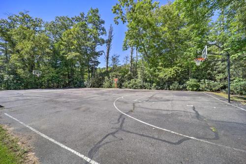 an empty basketball court with a basketball hoop at Lake and Pool Access Spacious Home in Newland in Newland