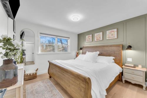 a bedroom with a large bed and a window at Luxury Family Home in Burlington in Burlington
