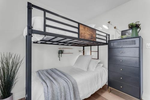 a bedroom with a bunk bed and a dresser at Luxury Family Home in Burlington in Burlington