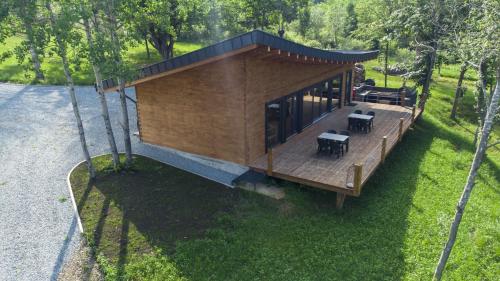 an overhead view of a tiny house with a deck at Pensiunea Hardic in Horodnic de Sus