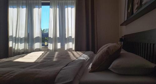 Ένα ή περισσότερα κρεβάτια σε δωμάτιο στο KELLER APARTMENT l 30