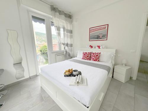 Ένα ή περισσότερα κρεβάτια σε δωμάτιο στο Liguria Home 4 - Recco centro a 2 minuti dal mare