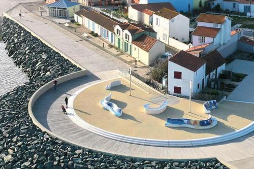 a skate park next to a body of water at Appartement 4 personnes bord mer in Yves