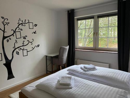 Llit o llits en una habitació de FEWODAYs: Ferienwohnung in Hamburg