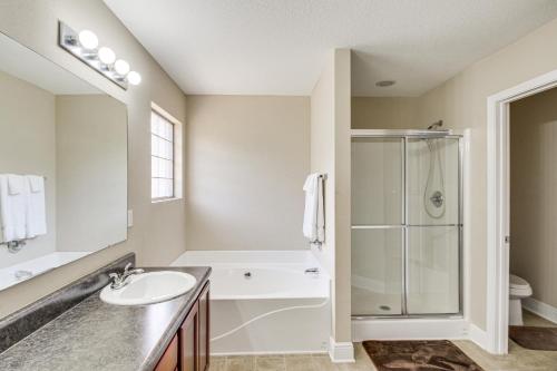 a bathroom with a sink and a shower at Crestview Family Home Screened Porch and Games! in Crestview