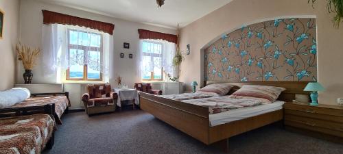 Postel nebo postele na pokoji v ubytování Pension Nahořečice