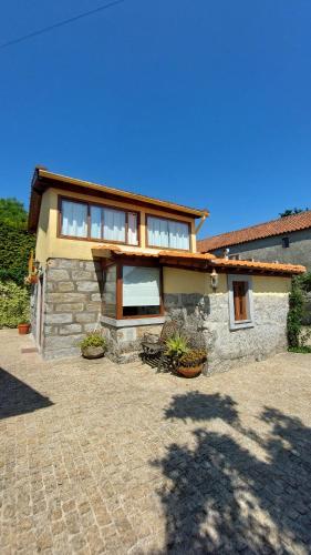 a house with a lot of windows on it at Alpendre in Guimarães
