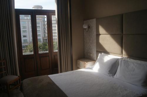 Hotel Chique Aliadosにあるベッド