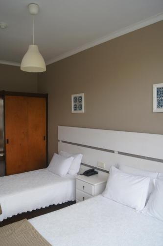 Hotel Chique Aliadosにあるベッド