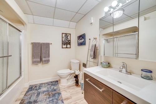 a bathroom with a sink and a toilet at Cozy Apartment Less Than 4 Miles to Downtown Anchorage! in Anchorage
