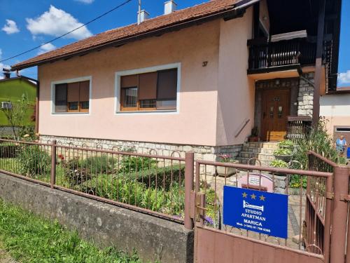 a house with a sign in front of it at Studio apartman Marica - Ogulin, Hrvatska in Ogulin