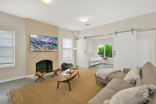 a living room with a couch and a fireplace at Stunning Home LifeStyle Miami in Miami