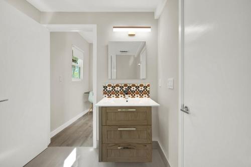 a bathroom with a sink and a mirror at Stunning Home LifeStyle Miami in Miami
