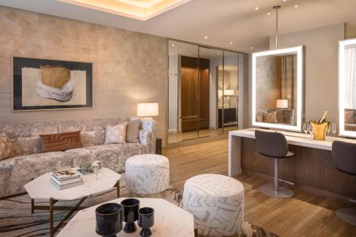 a living room with a couch and a table at Caesars Republic Scottsdale, a Hilton Hotel in Scottsdale
