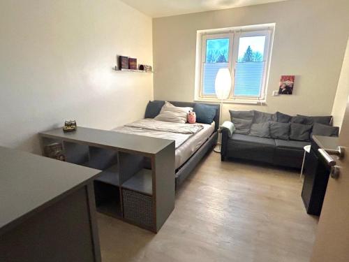 a living room with a couch and a table at Wunderschönes, großes Traumhaus in Lüchow