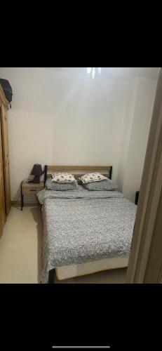 Säng eller sängar i ett rum på Appartement Thionville proche luxembourg