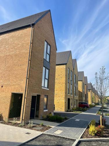 a row of brick houses on a street at Home in Greenhithe in Kent