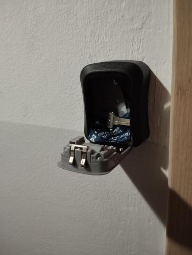 a black electrical outlet on a wall at Attico Viva in Plitvička Jezera