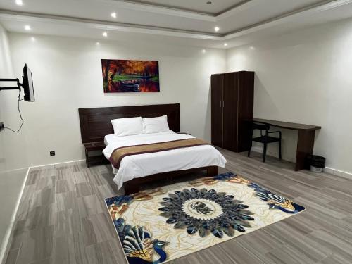 Un pat sau paturi într-o cameră la Majorelle hôtel