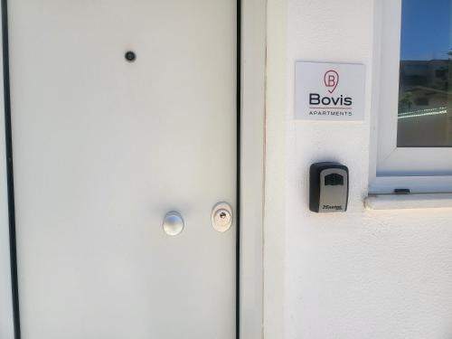 a door with a sign that says bows on it at Bovis Apartments #2 in Porto Rafti