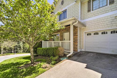 a house with a tree and a garage at Lillys Mountain Escape in Banner Elk