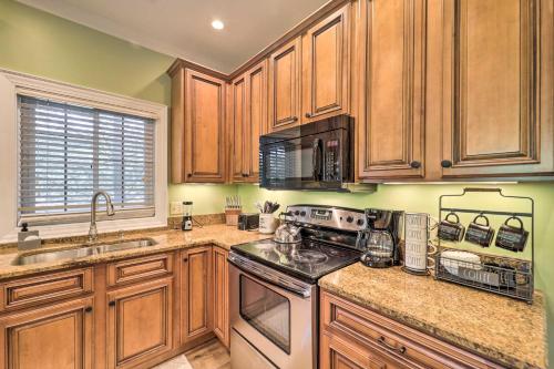 a kitchen with wooden cabinets and a stove top oven at Lillys Mountain Escape in Banner Elk