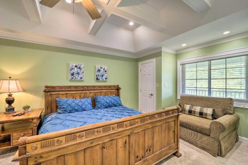 a bedroom with a bed and a chair and a window at Lillys Mountain Escape in Banner Elk
