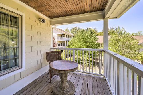 a porch with a table and a chair on it at Lillys Mountain Escape in Banner Elk