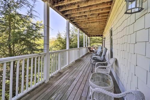 a row of benches on the porch of a house at Lillys Mountain Escape in Banner Elk