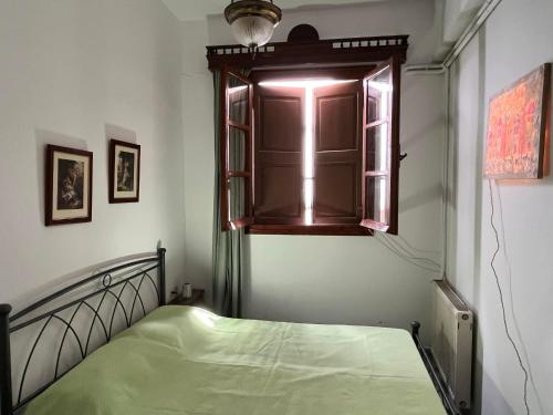Кровать или кровати в номере Partarolos Traditional House