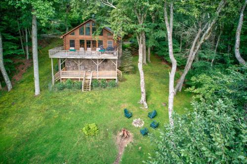 an aerial view of a log cabin in the woods at Banner Bunks at River Run in Banner Elk