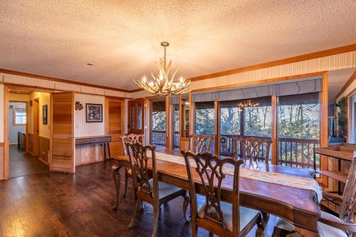a dining room with a wooden table and chairs at Eagles Rest in Fleetwood
