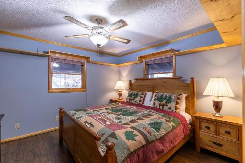 a bedroom with a bed and a ceiling fan at Eagles Rest in Fleetwood