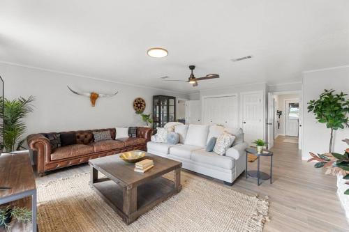 a living room with a couch and a table at Farm Retreat with Jacuzzi, Fire Pit, Mini Goats, Mini Ponies and Mini Cows in San Marcos