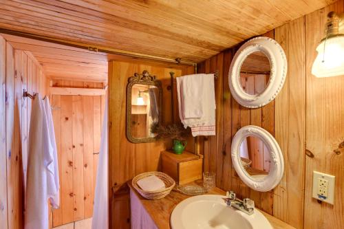 a bathroom with a sink and two mirrors at Oceanfront Cottage with Deck 2 Mi to Boothbay Harbor in West Boothbay Harbor