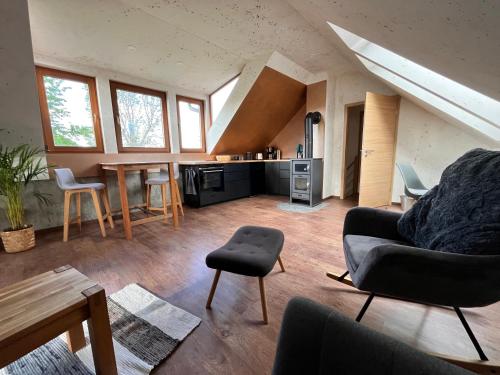 a living room with a couch and a table at Ferienhaus Katharina in Hoyerswerda