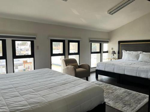 Hotel Lunada tesisinde bir odada yatak veya yataklar