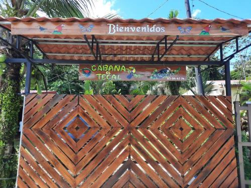 a wooden gate with a sign on top of it at Cabaña el Tecal in San Francisco