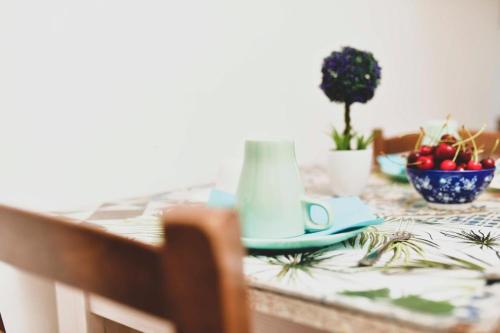 a dining room table with a table cloth with a table sidx sidx at La Bottaia de' Roveri in Ortona
