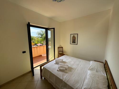 Ένα ή περισσότερα κρεβάτια σε δωμάτιο στο Residenza Villa Fiorita