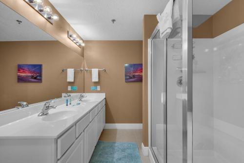 a bathroom with two sinks and a shower at Ariel Dunes I 1404 in Destin