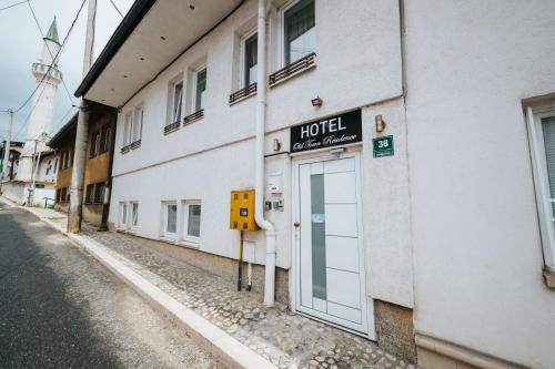 a hotel sign on the side of a building at Old Town Residence Rooms in Sarajevo
